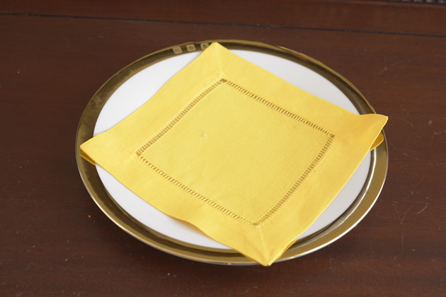 Solid colored hemstitch cocktail napkin 6". Minion Yellow color